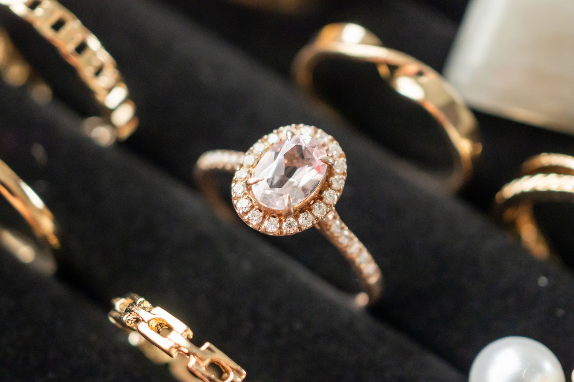Gold diamond rings displayed in luxury retail store, as part of fine jewelry collection.
