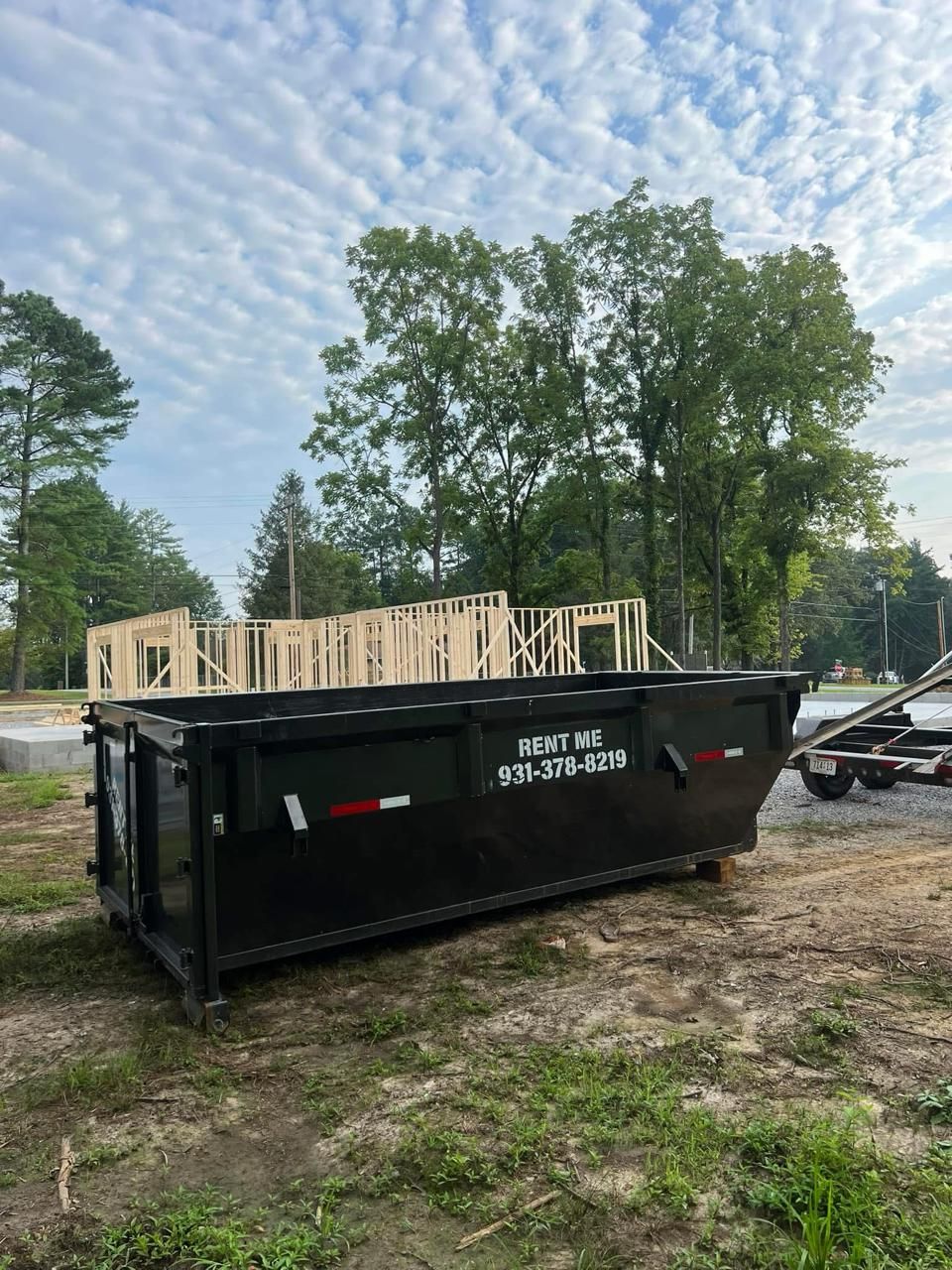 Construction dumpster rental for home renovation project in Manchester TN with building materials