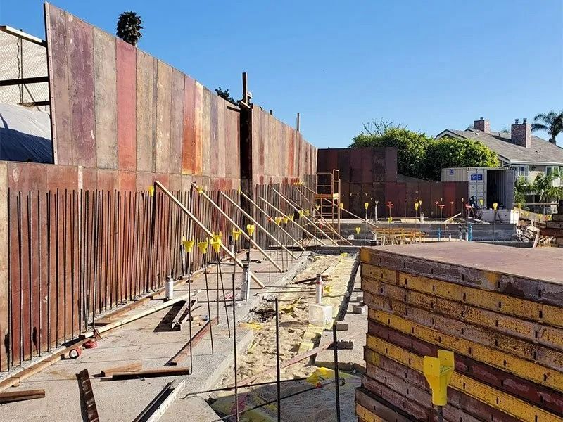 A fence is being built on a construction site.
