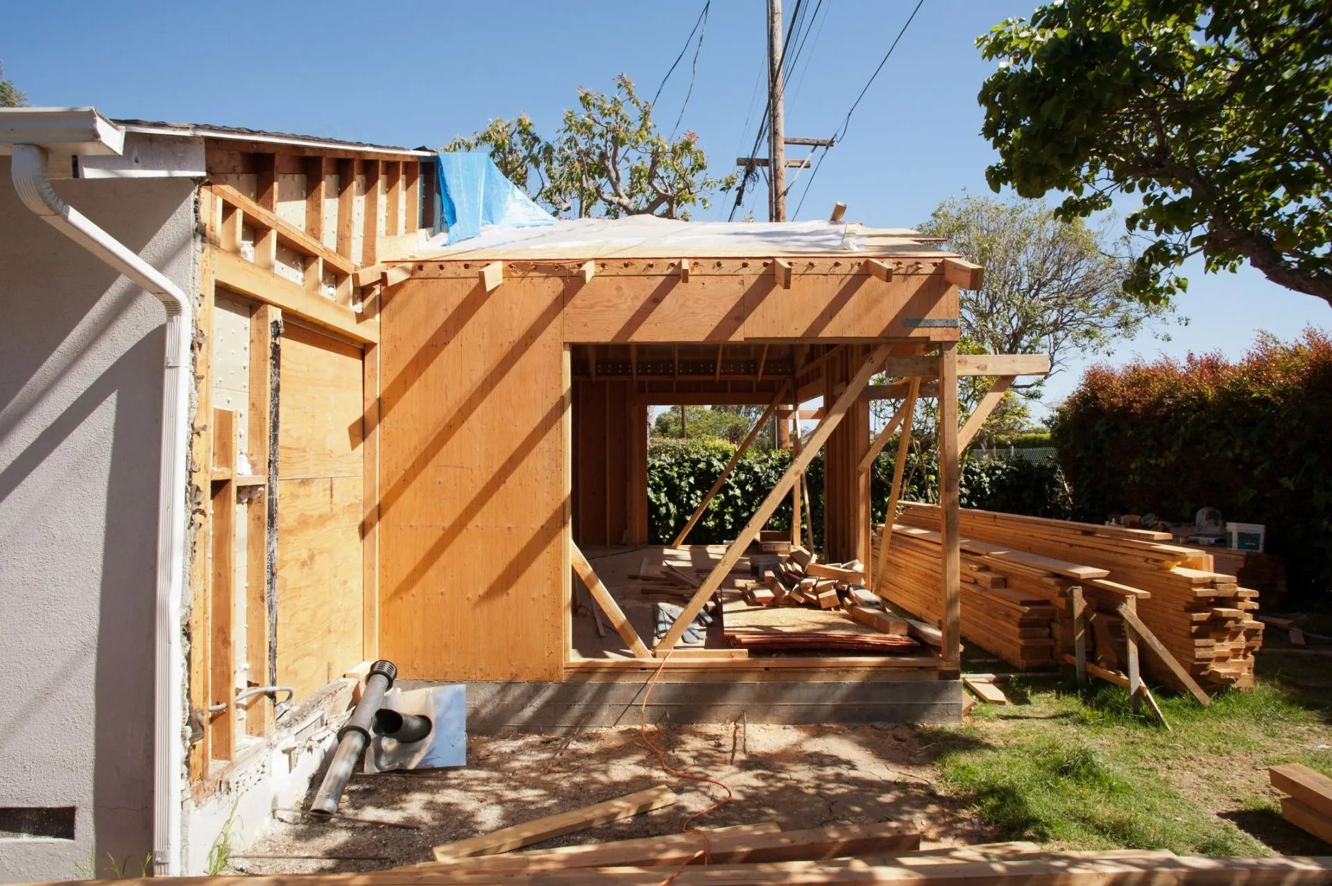 A house that is being built with a lot of wood