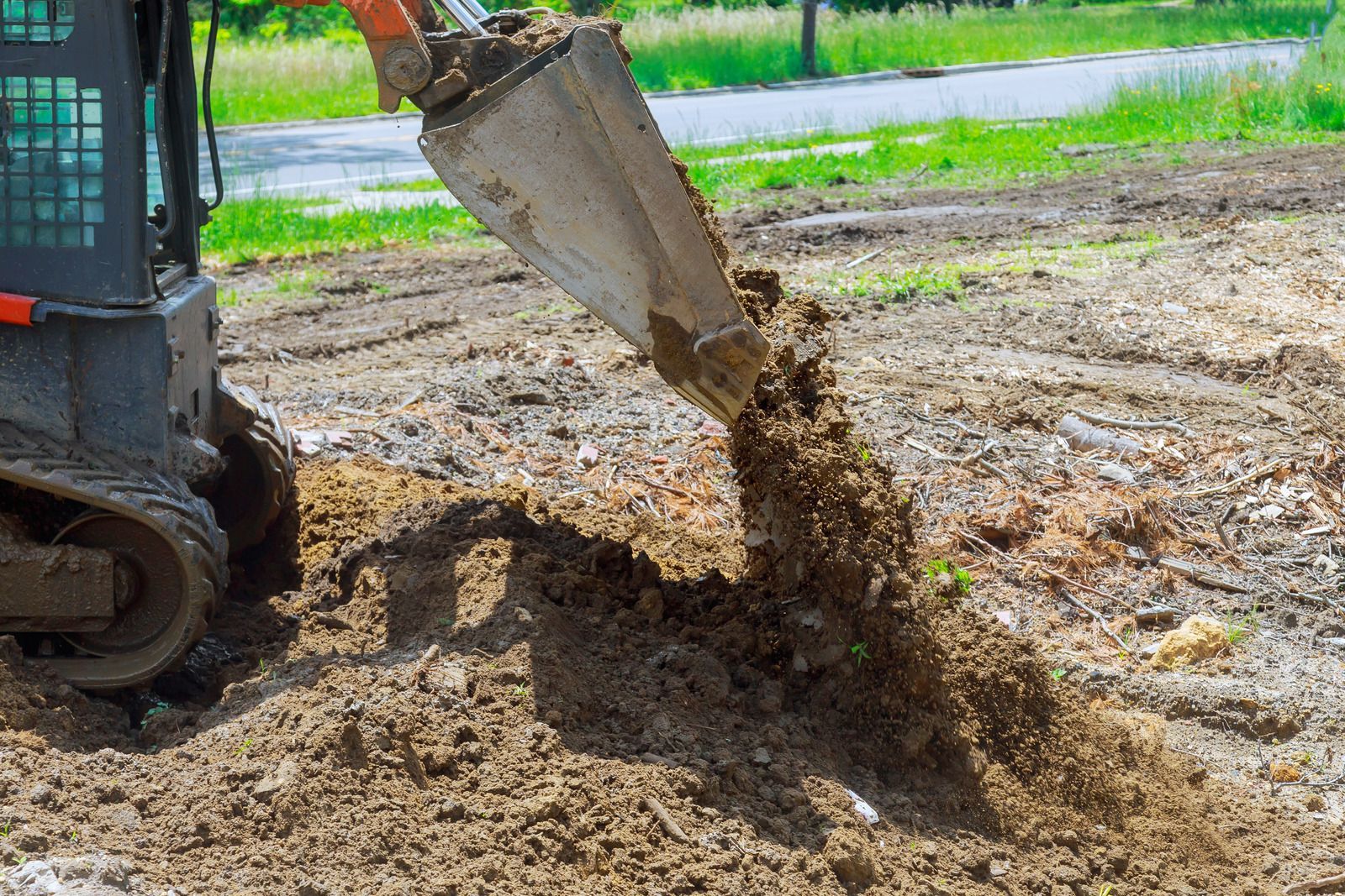 A bulldozer is digging a hole in the ground.