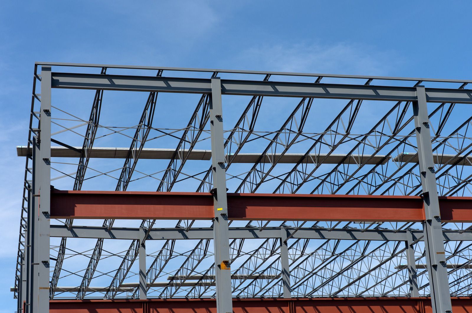 A large metal structure with a blue sky in the background
