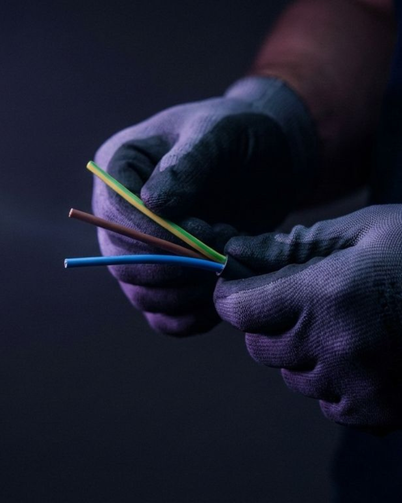 Electrician wiring a socket in an Algarve villa