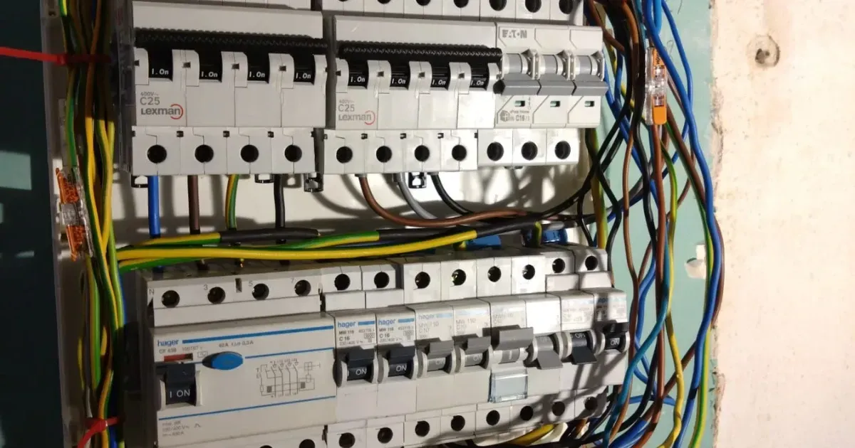 Open consumer unit with circuit breakers inspected by DGEG electricians