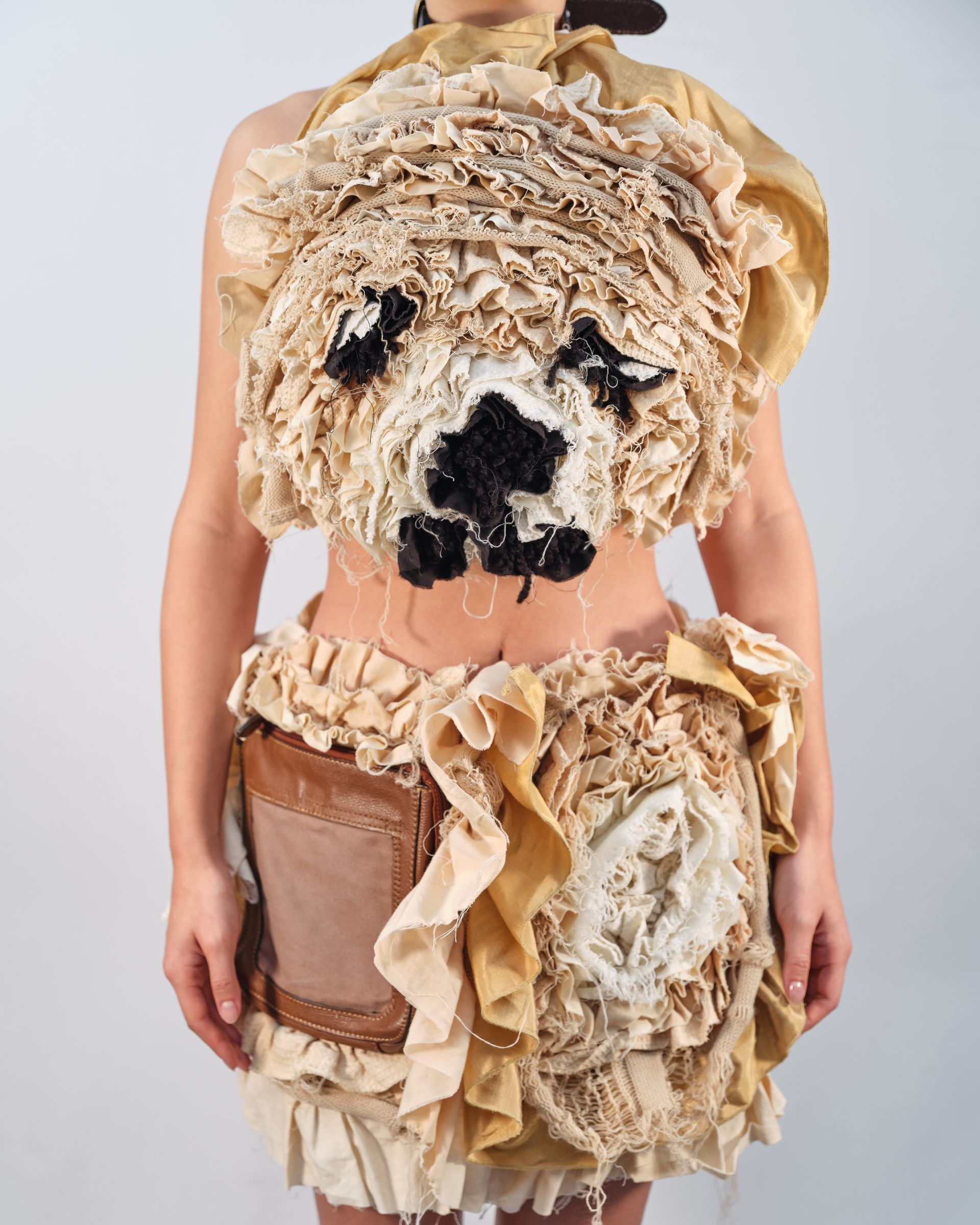 A woman is wearing a dress that looks like a teddy bear