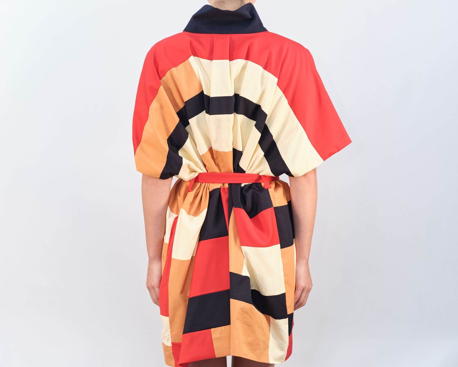 The back of a person wearing a colorful dress