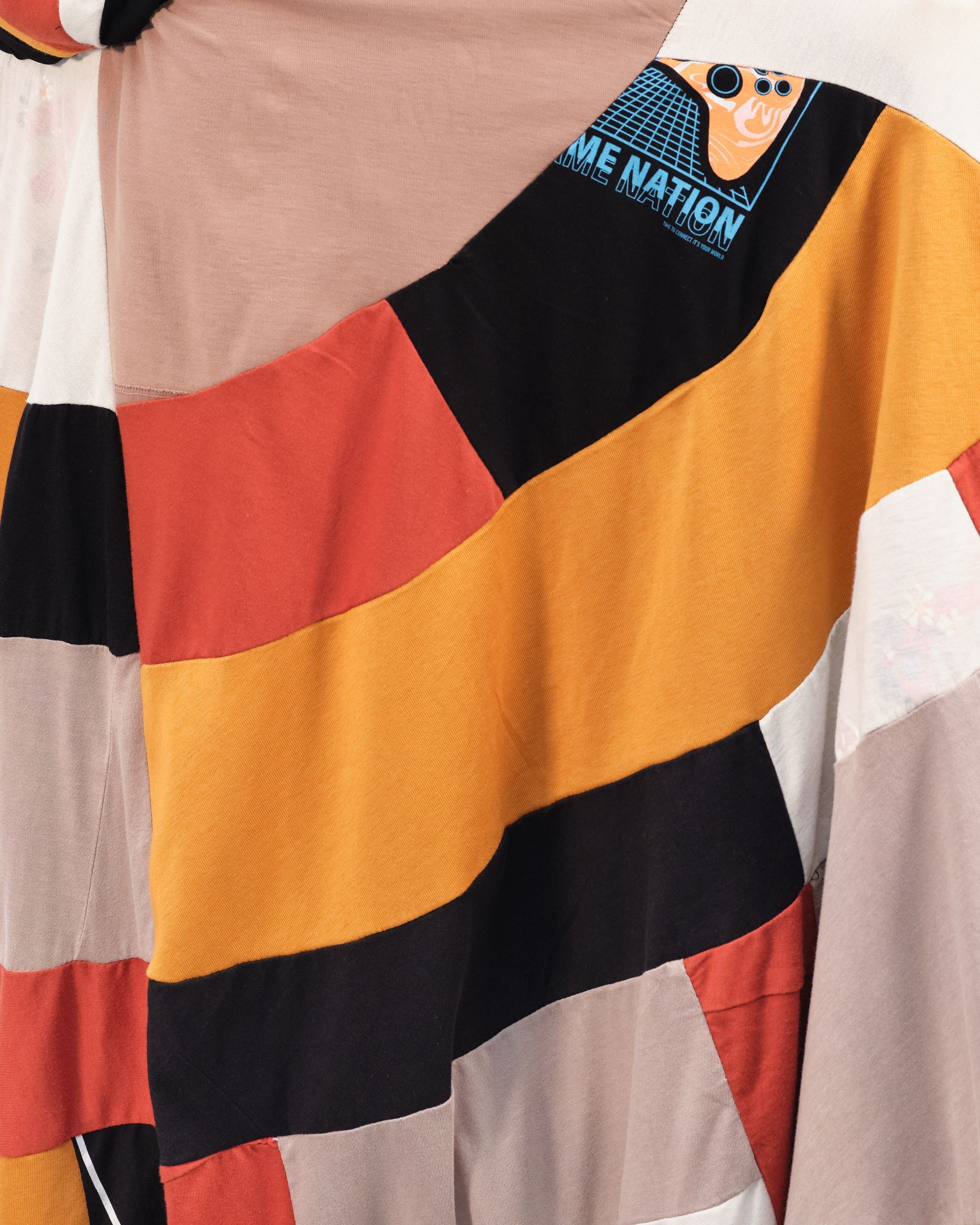 A close up of a sweater that says be nation