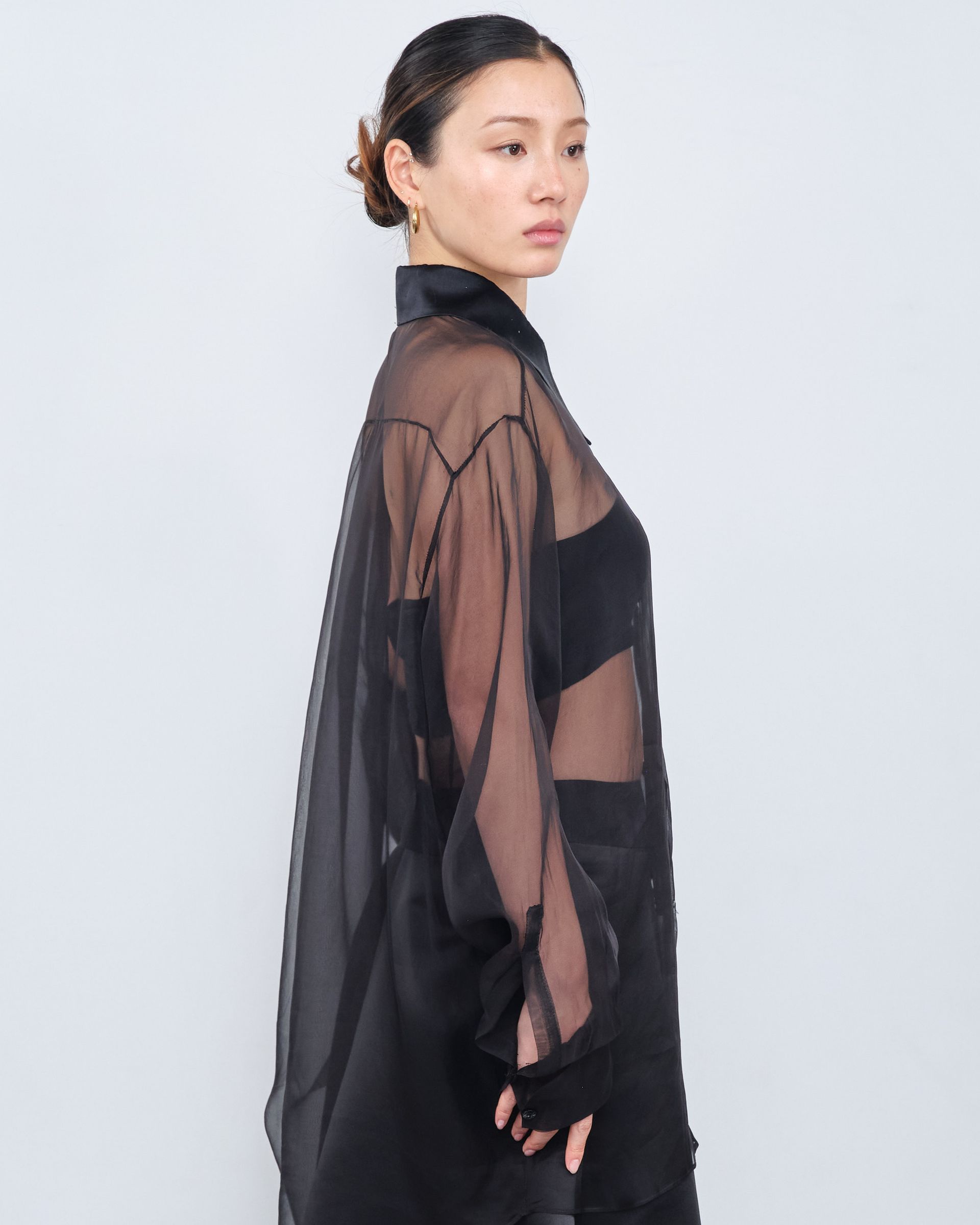 A woman is wearing a black shirt and black pants