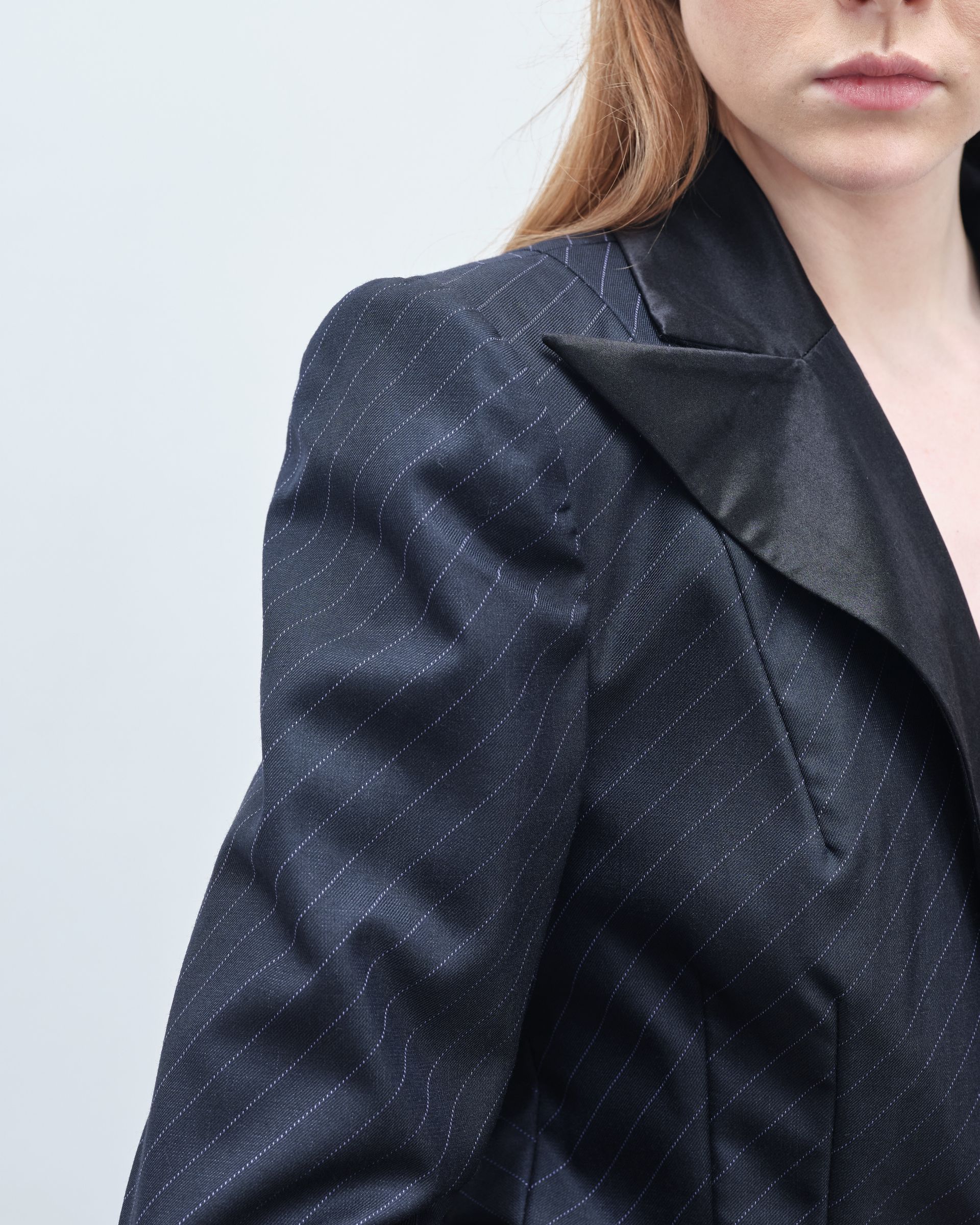 A close up of a woman wearing a black jacket