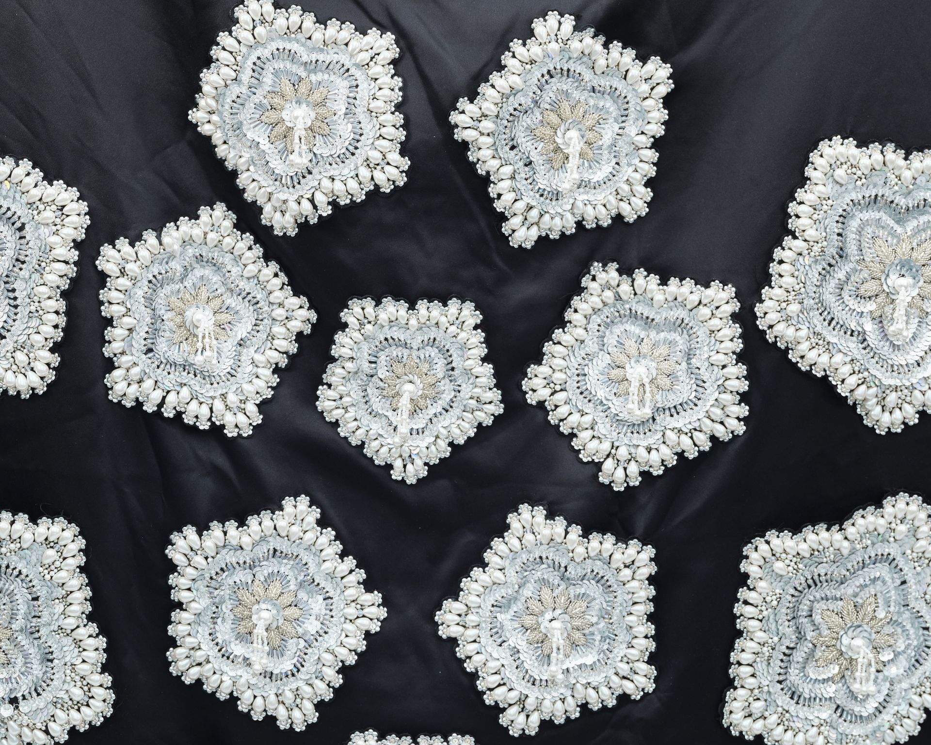 A bunch of white flowers on a black cloth