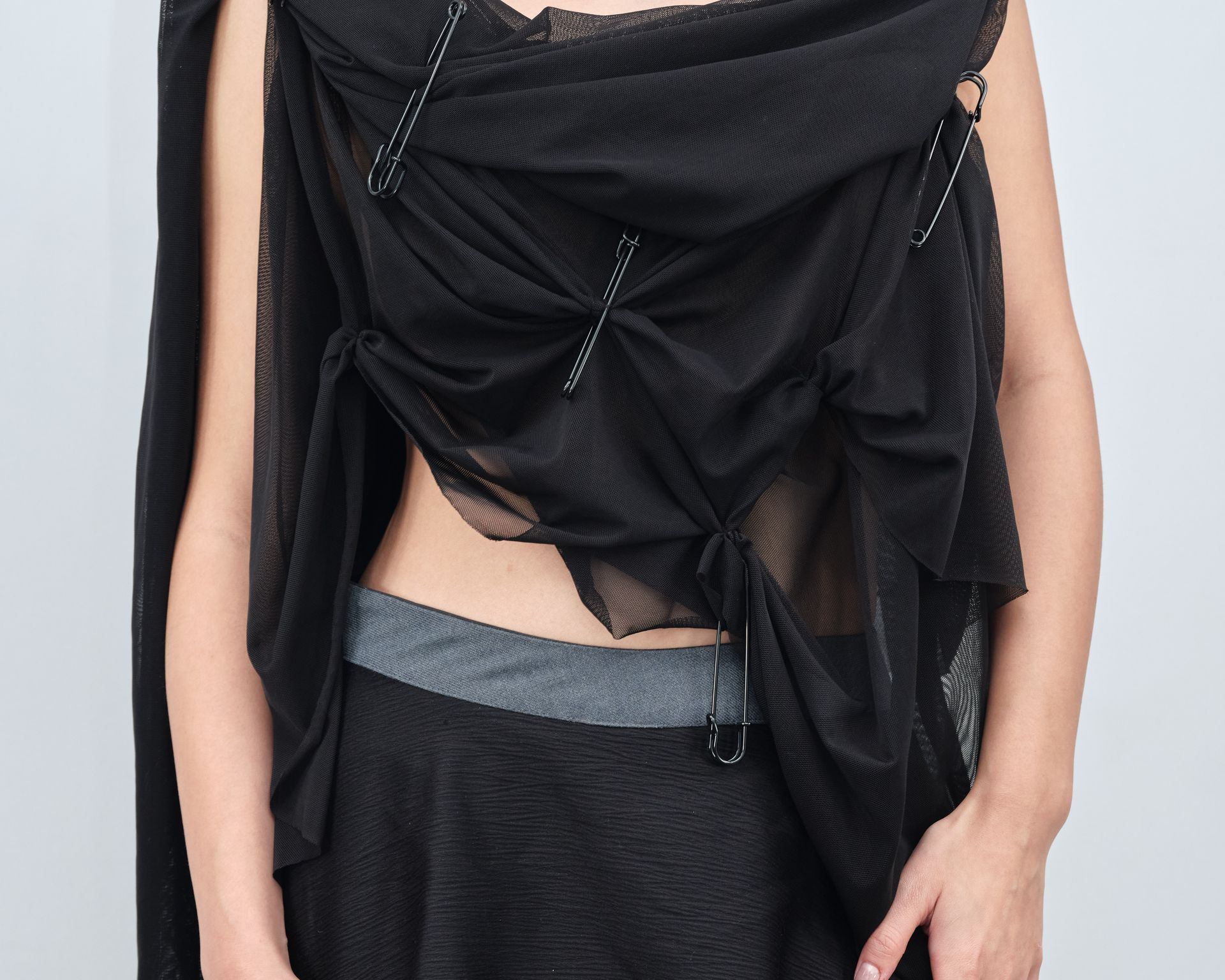 A woman wearing a black scarf around her neck