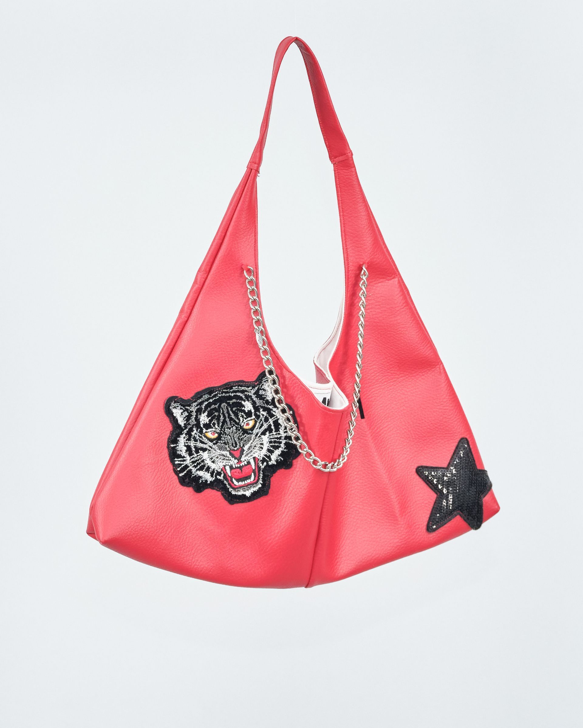 A red purse with a tiger and a star on it