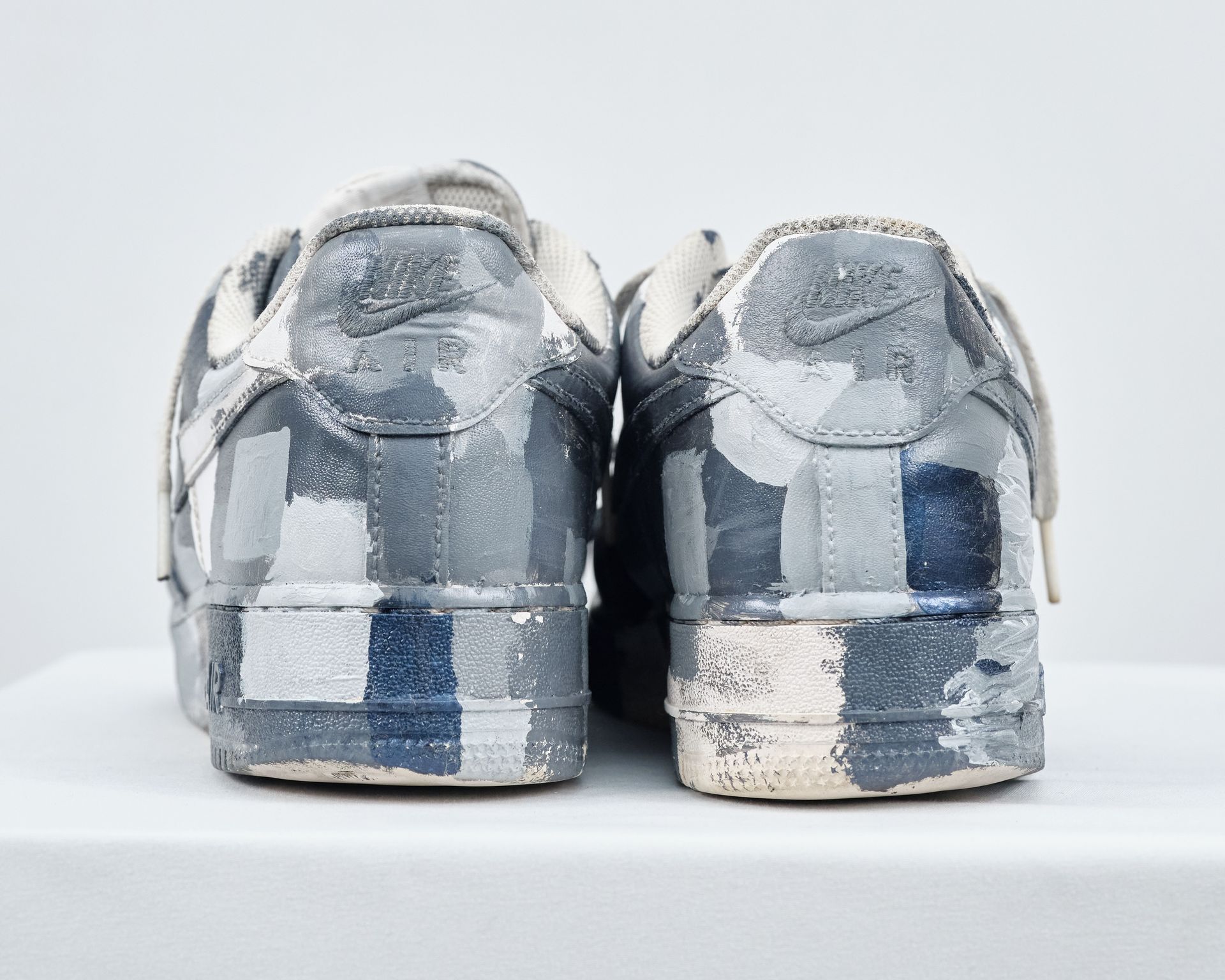 The back of a pair of nike air force 1 sneakers