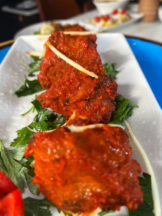 Paneer butter masala with rice and naan bread.