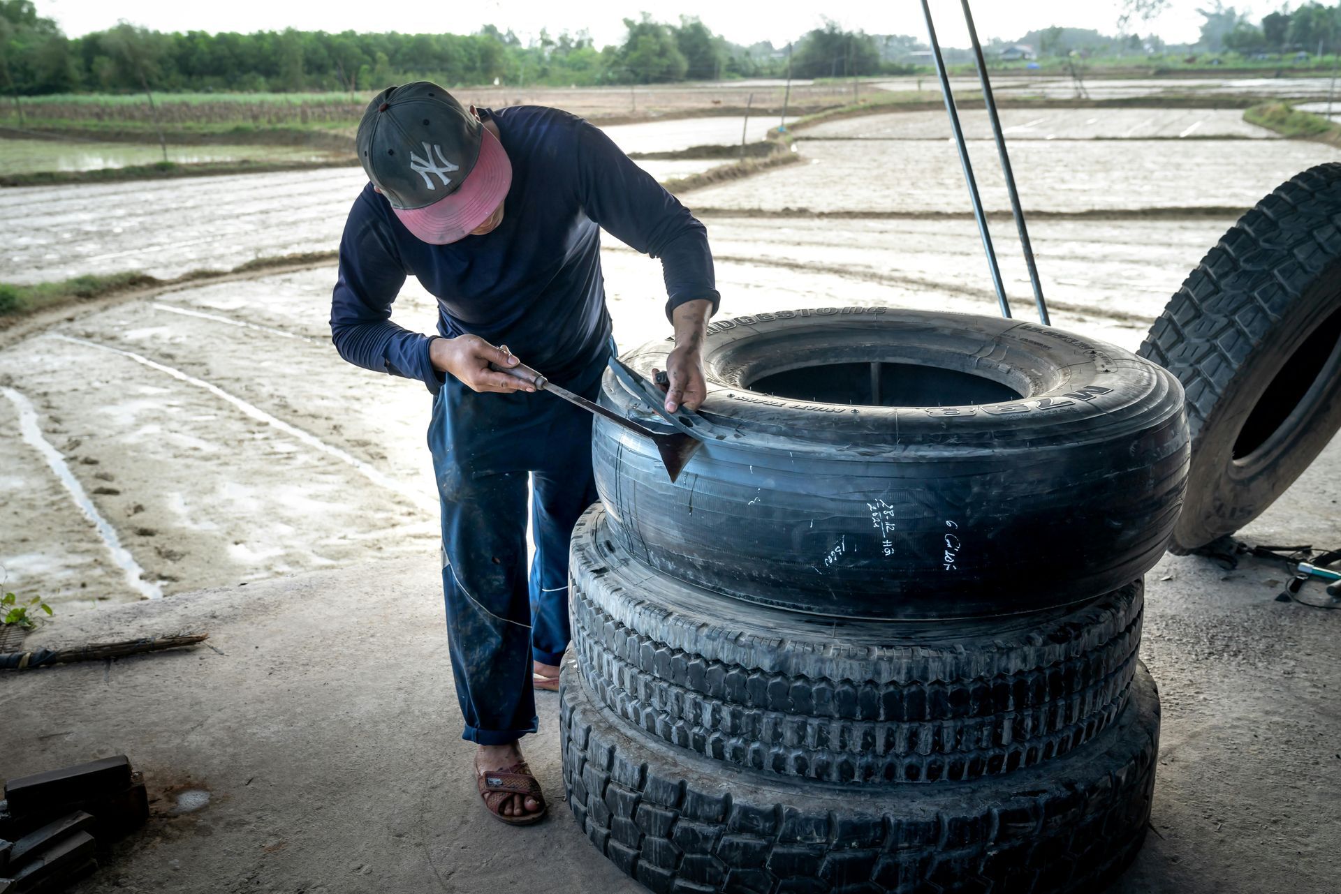 man repairing tire