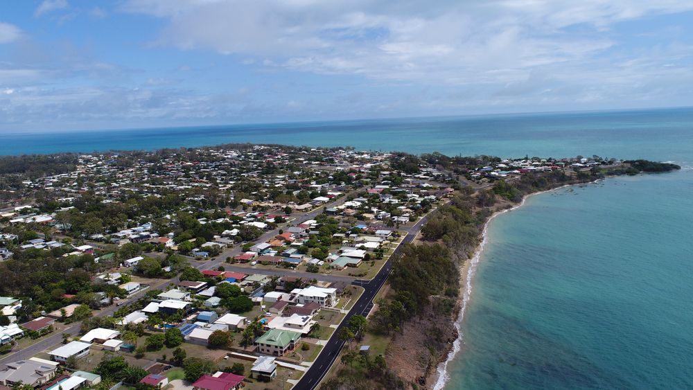 An Aerial View of a Small Town Next to the Ocean — Alert Smoke Alarm Compliance in Hervey Bay, QLD