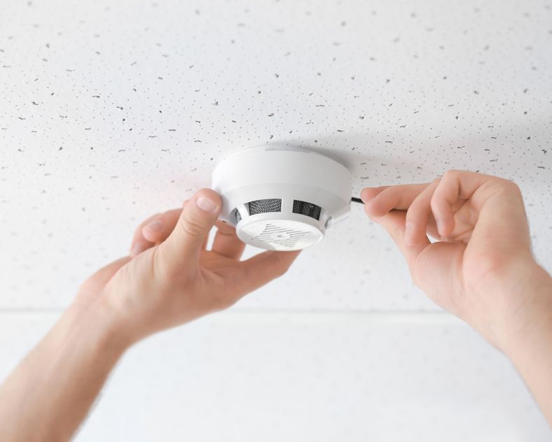 Installing Smoke Detector On Ceiling — Alert Smoke Alarm Compliance in Maryborough, QLD