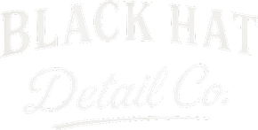 Logo for Black Hat Detail Co. in white, stylized font. "Black Hat" arched above "Detail Co.".