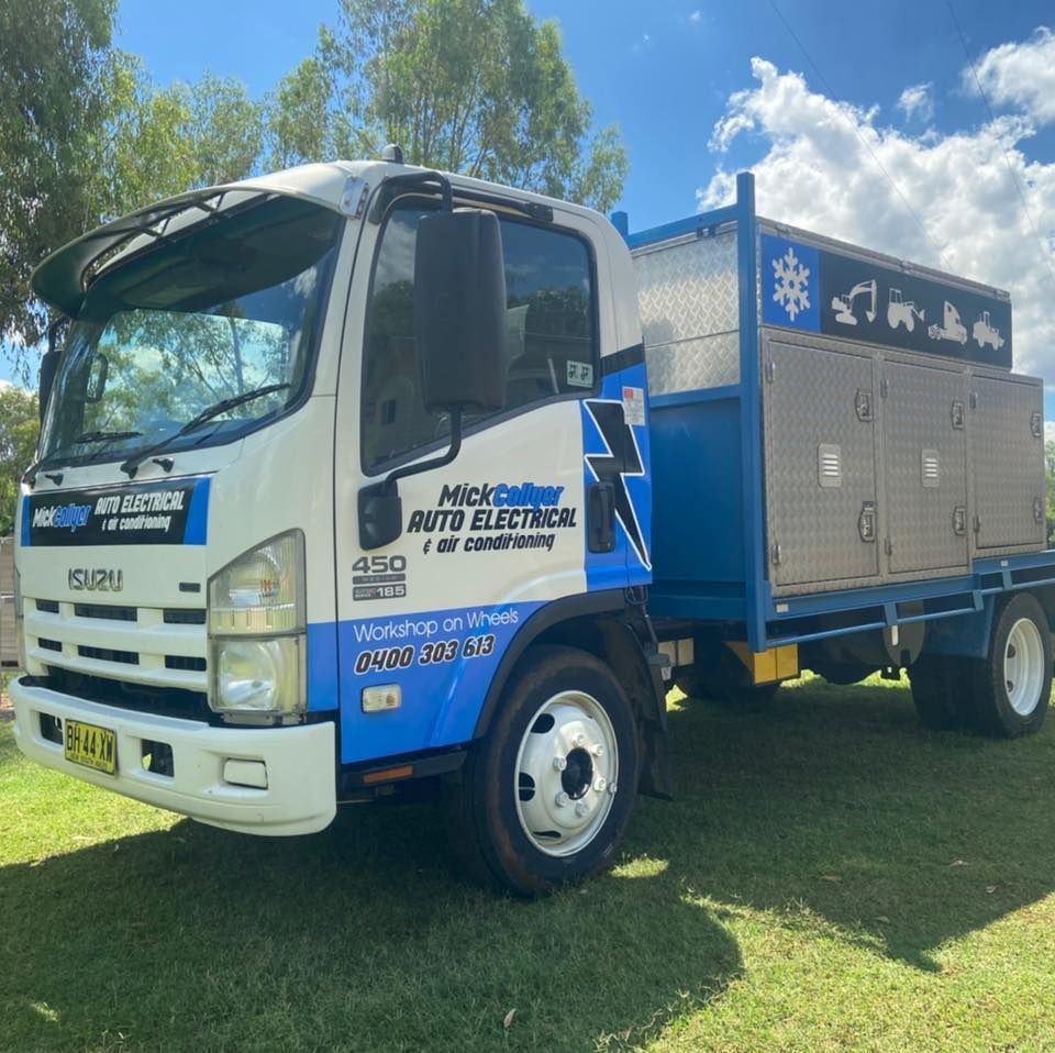 A Mick Collyer Service Truck Parked Outside on a Lawn — Auto Electrical Service Tamworth