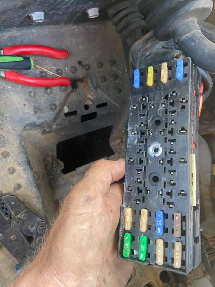 A Person is Holding a Fuse Box in his Hand — Auto Electrician Quirindi