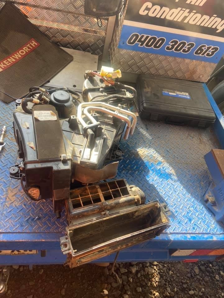 Vehicle Parts Kept On A Blue Metal Surface — Auto Electrician Gunnedah