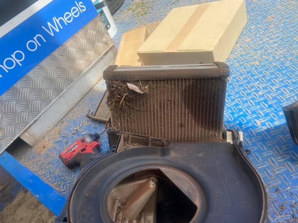 A Dirty Radiator is on a Blue Floor with A Red Drilling Gun — Auto Electrician Gunnedah