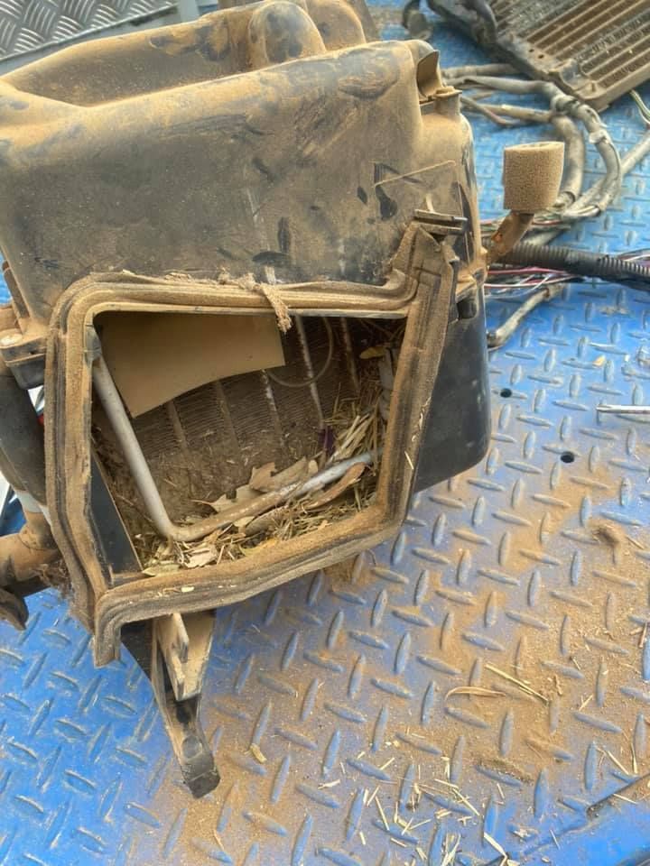 A Dirty Vehicle Part kept on a Blue Metal Surface — Auto Electrician Tamworth