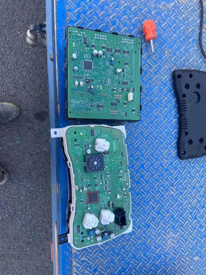Two Pieces of Electronic Equipment on a Blue Surface — Auto Electrical Repairs Tamworth