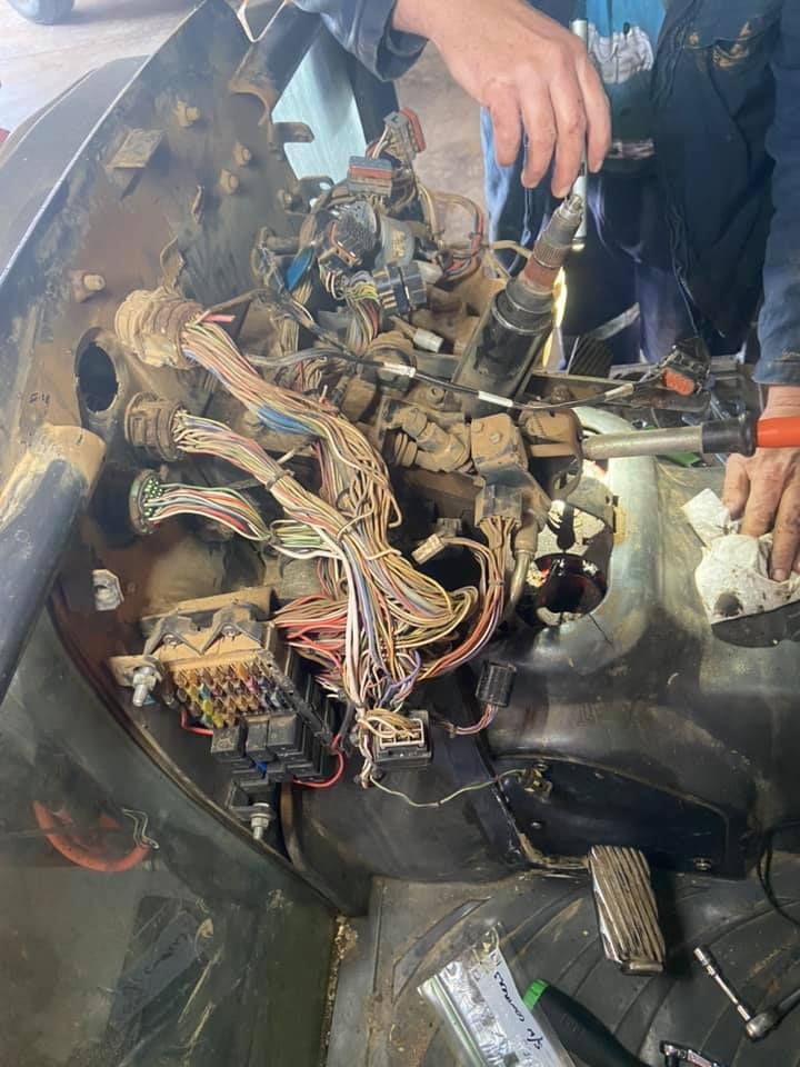 A Man is Working on the Electrical System of a Car — Auto Electrical Service Tamworth