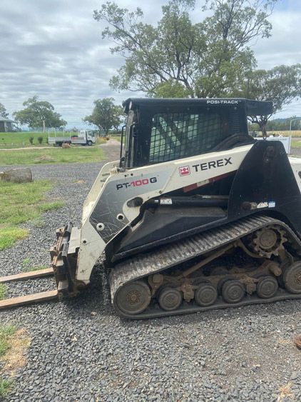 A Skid Steer Loader is Parked on a Gravel Road — Auto Electrical Service Tamworth