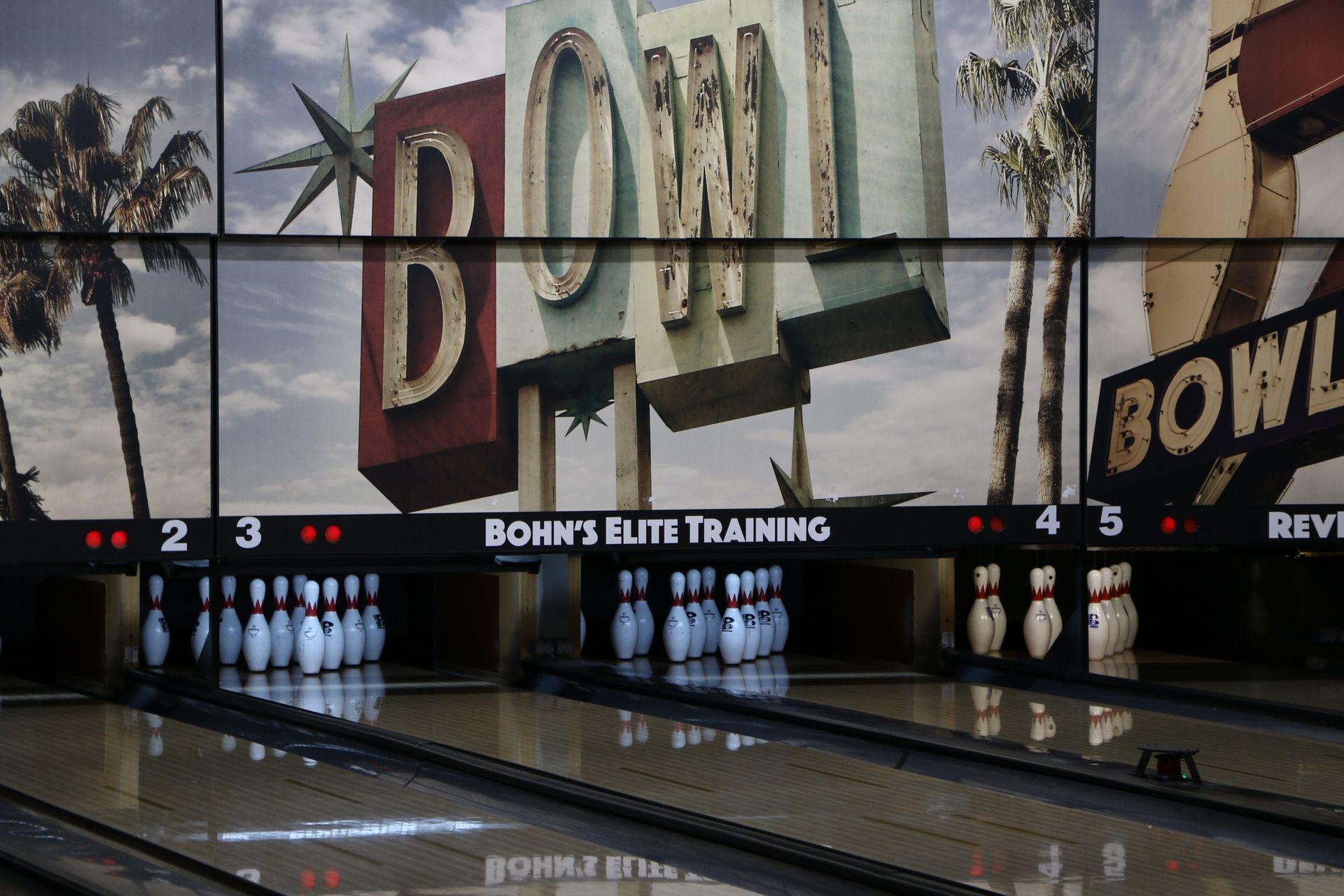Bowling alley with retro signage and lanes at Howell Lanes