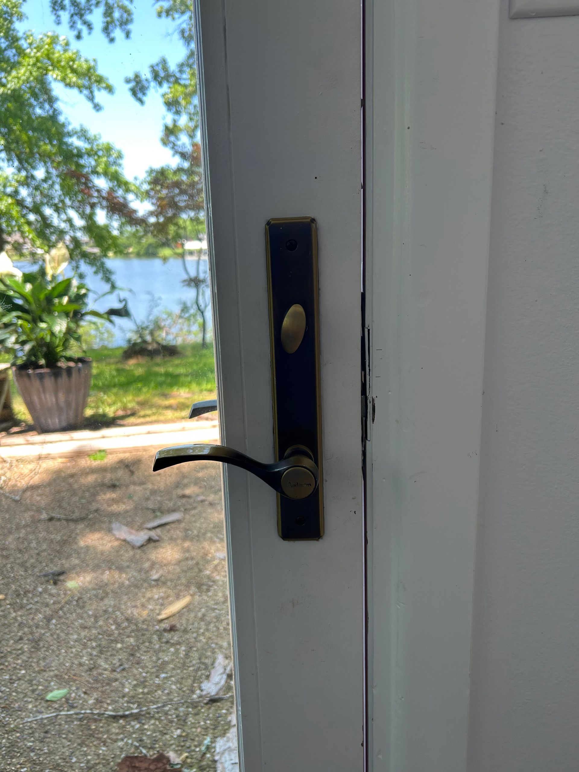 Door with black and gold hardware; exterior view.