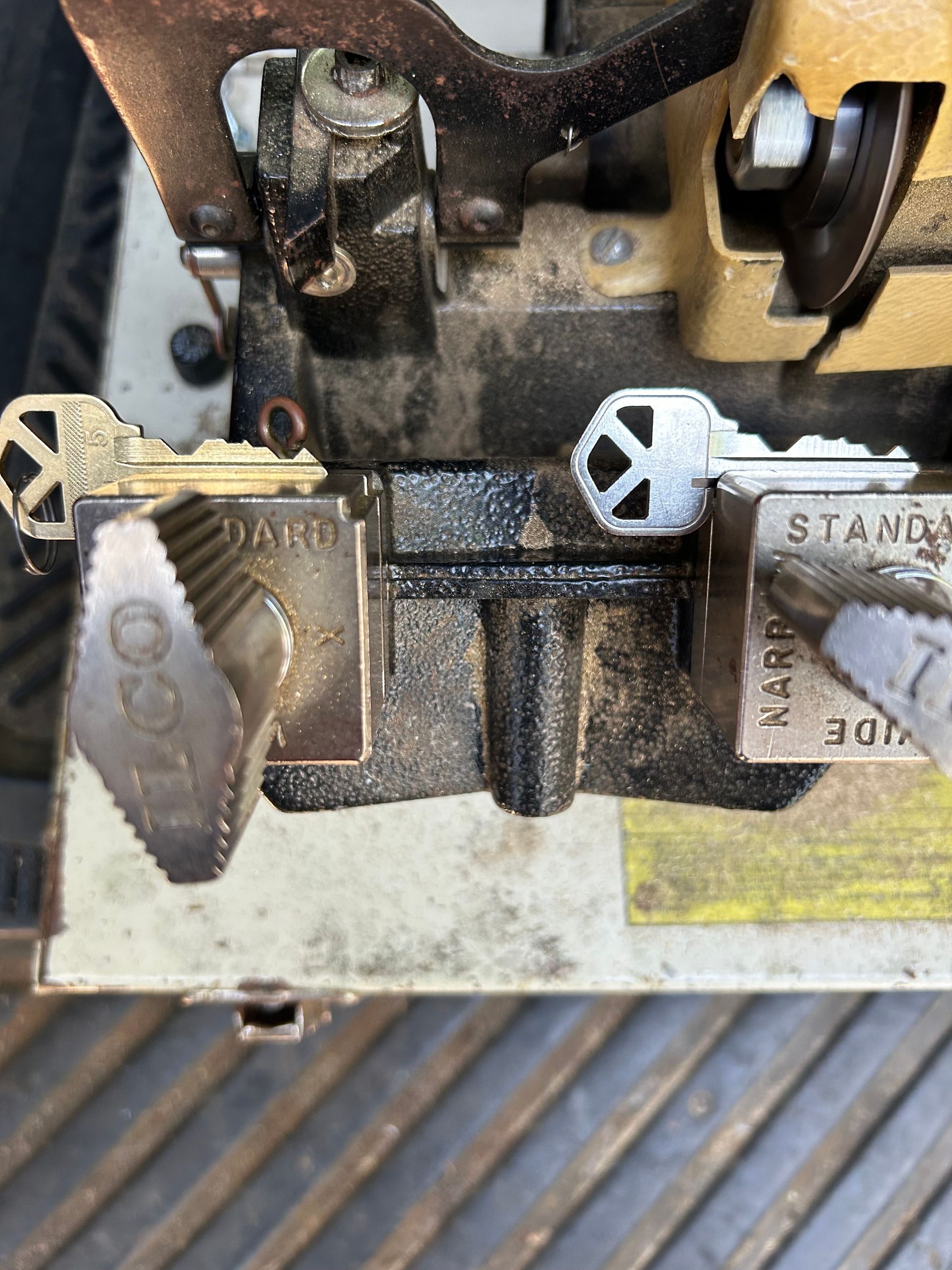 Key cutting machine with two keys clamped.