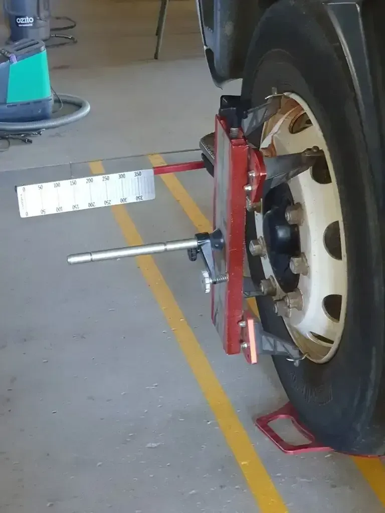 A Truck Is Being Aligned With A Machine In A Garage — Geisler Truck & Trailer Wheel Alignments In Pleystowe, QLD