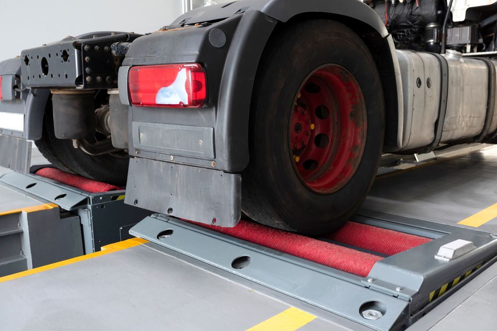 A Truck Is Being Tested On A Machine In A Garage — Geisler Truck & Trailer Wheel Alignments In Pleystowe, QLD