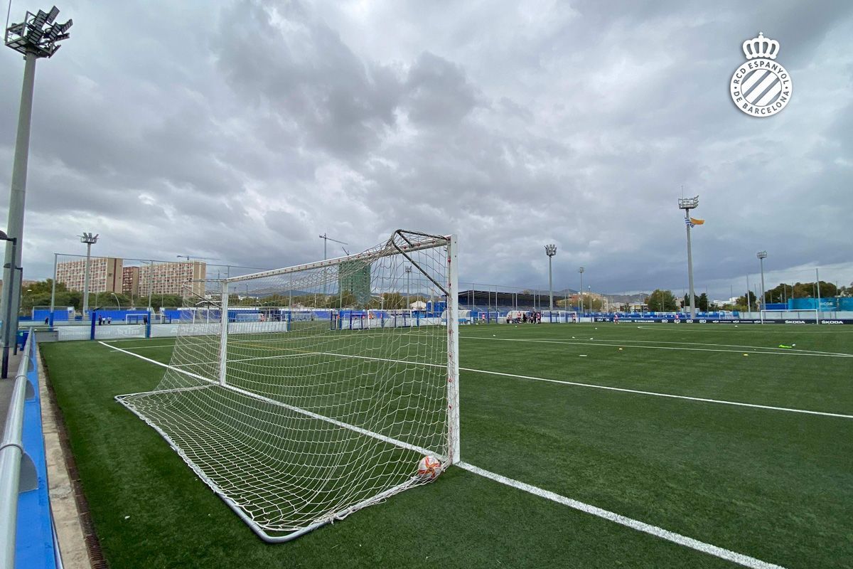 A soccer field with a goal in the middle of it