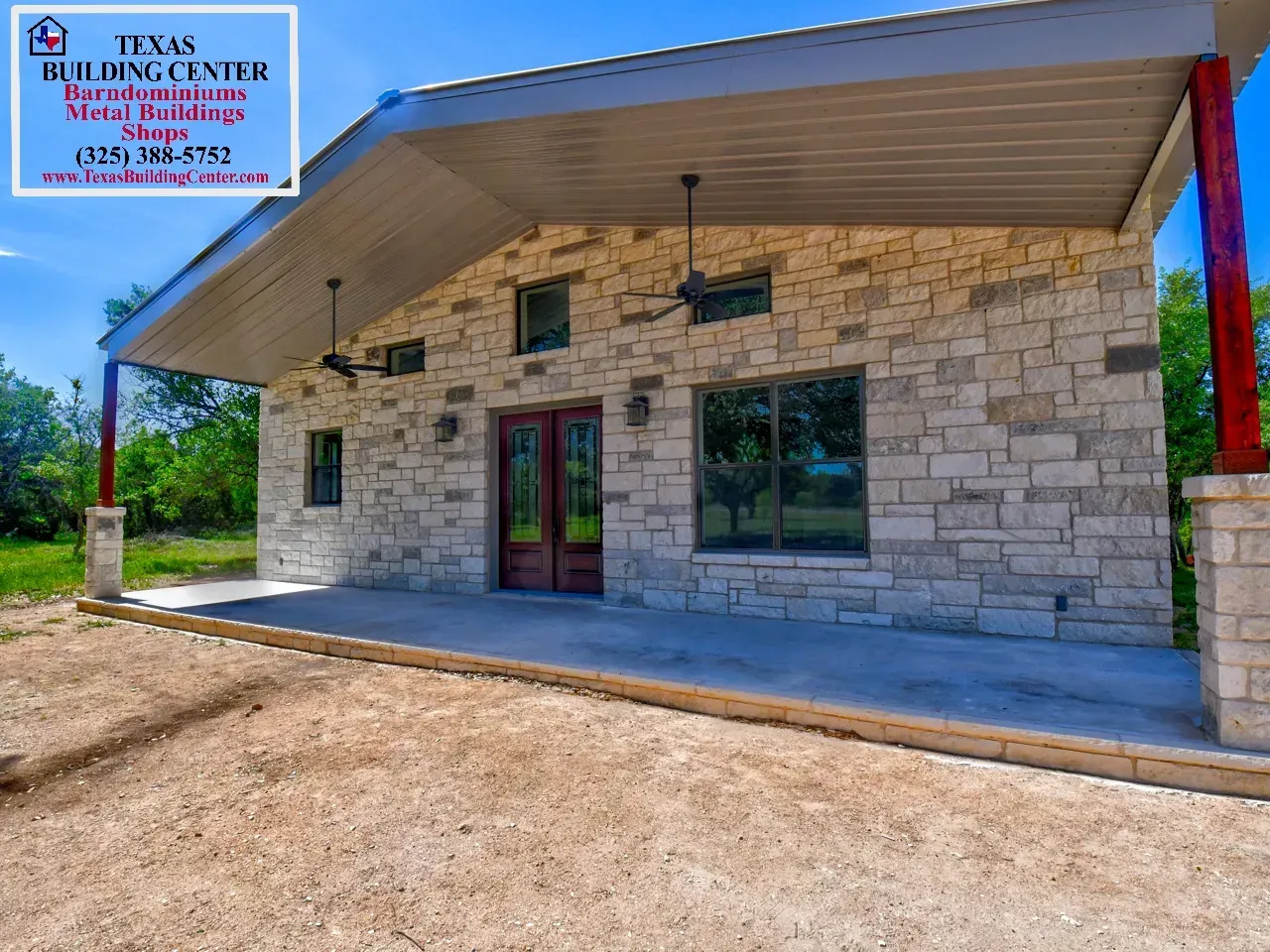 A stone building with a porch. Red pillars and a blue sky. Texas Building Center logo is visible.