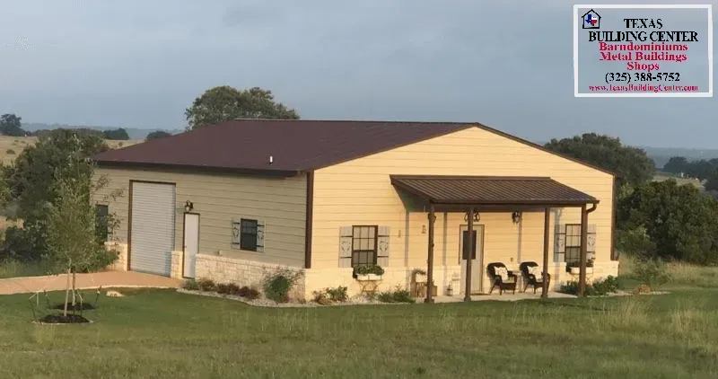Beige metal building with brown roof and porch, Texas Building Center logo, set on grassy hill.