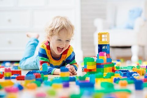 Child playing with toy blocks
