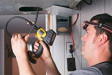 Worker cleaning ventilation - Duct Cleaning in Post Falls, ID