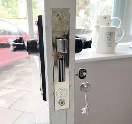 ERA mortice lock in chrome installed on wooden door