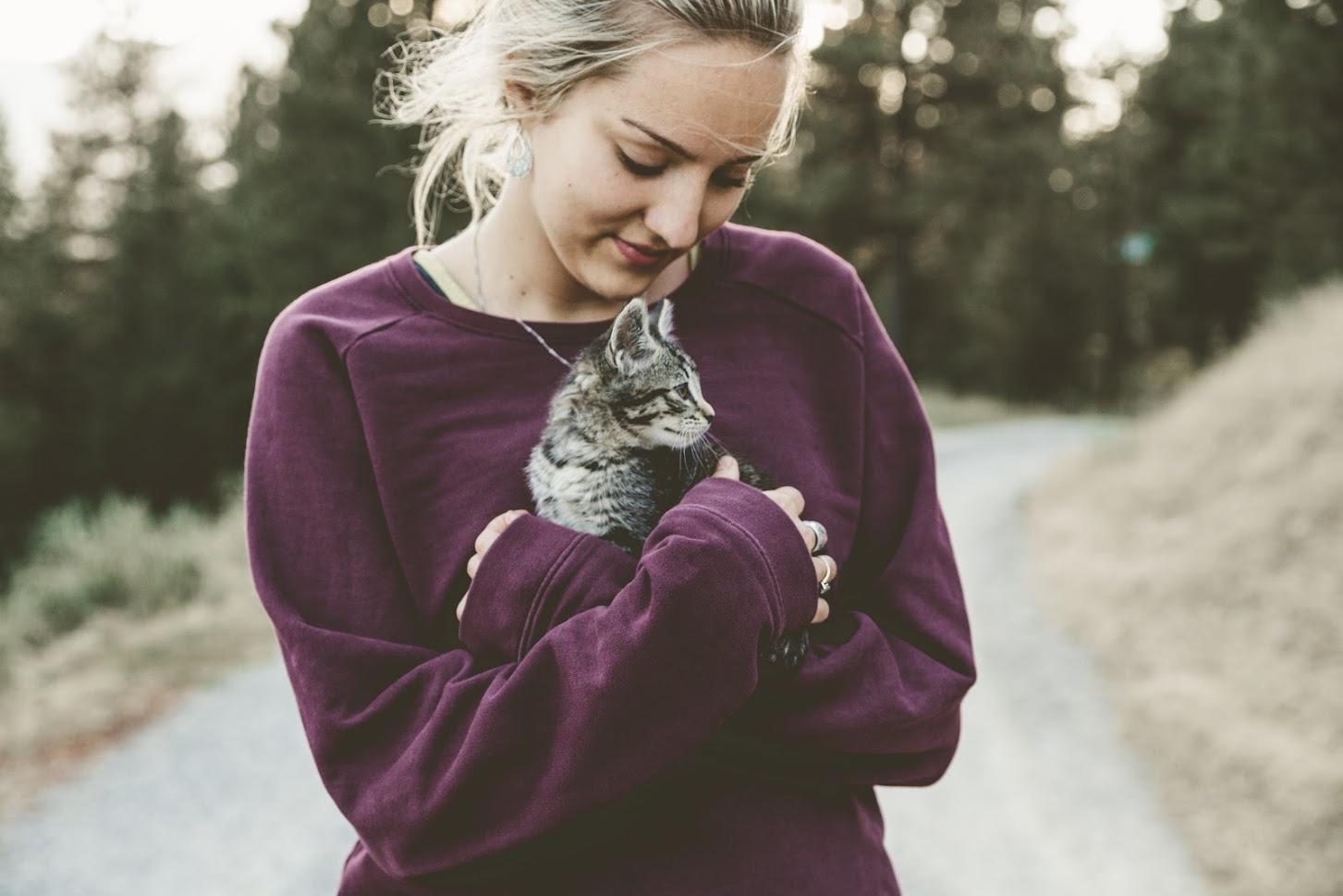 Lady Carrying A Cat — Seattle, WA — South Seattle Veterinary Hospital