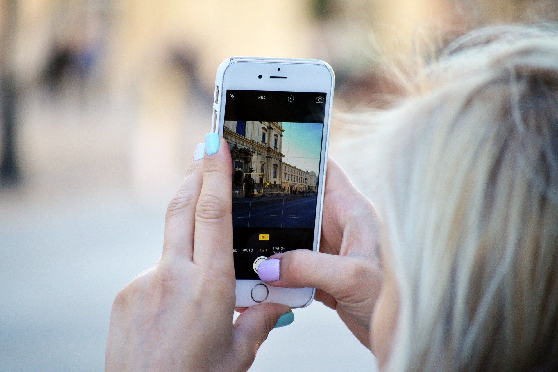 women holding her phone and creating an Instagram video