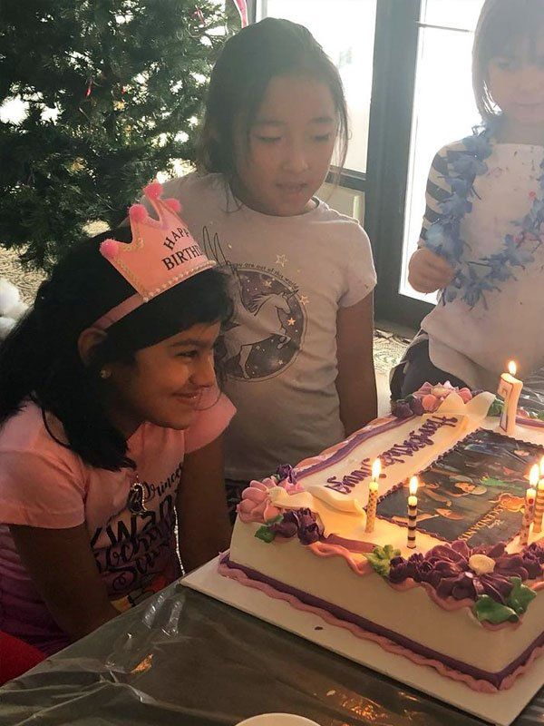two girls with birthday cake