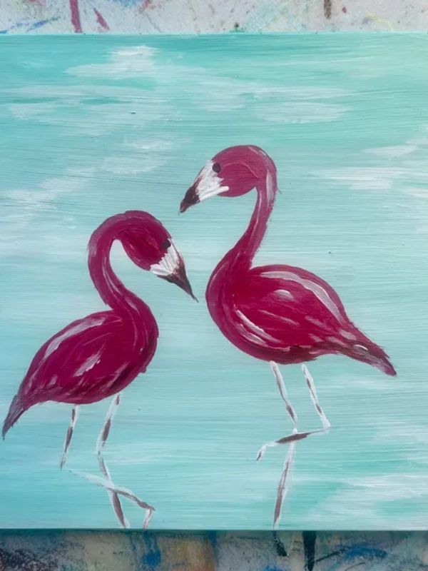 A painting of two flamingos on a blue background