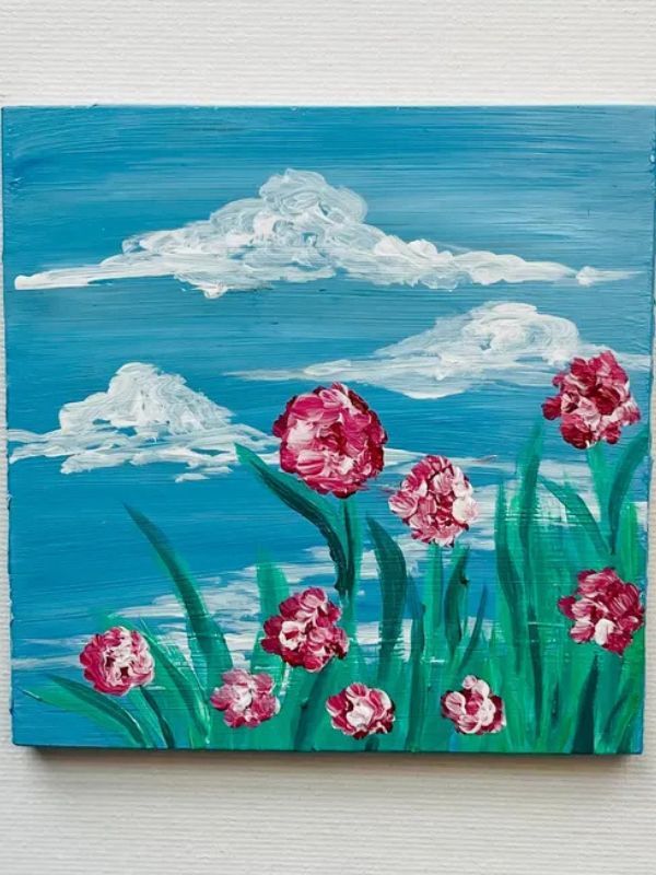 A painting of pink flowers against a blue sky with clouds