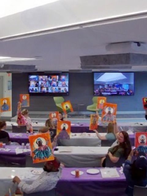 virtual group photo holding their paintings