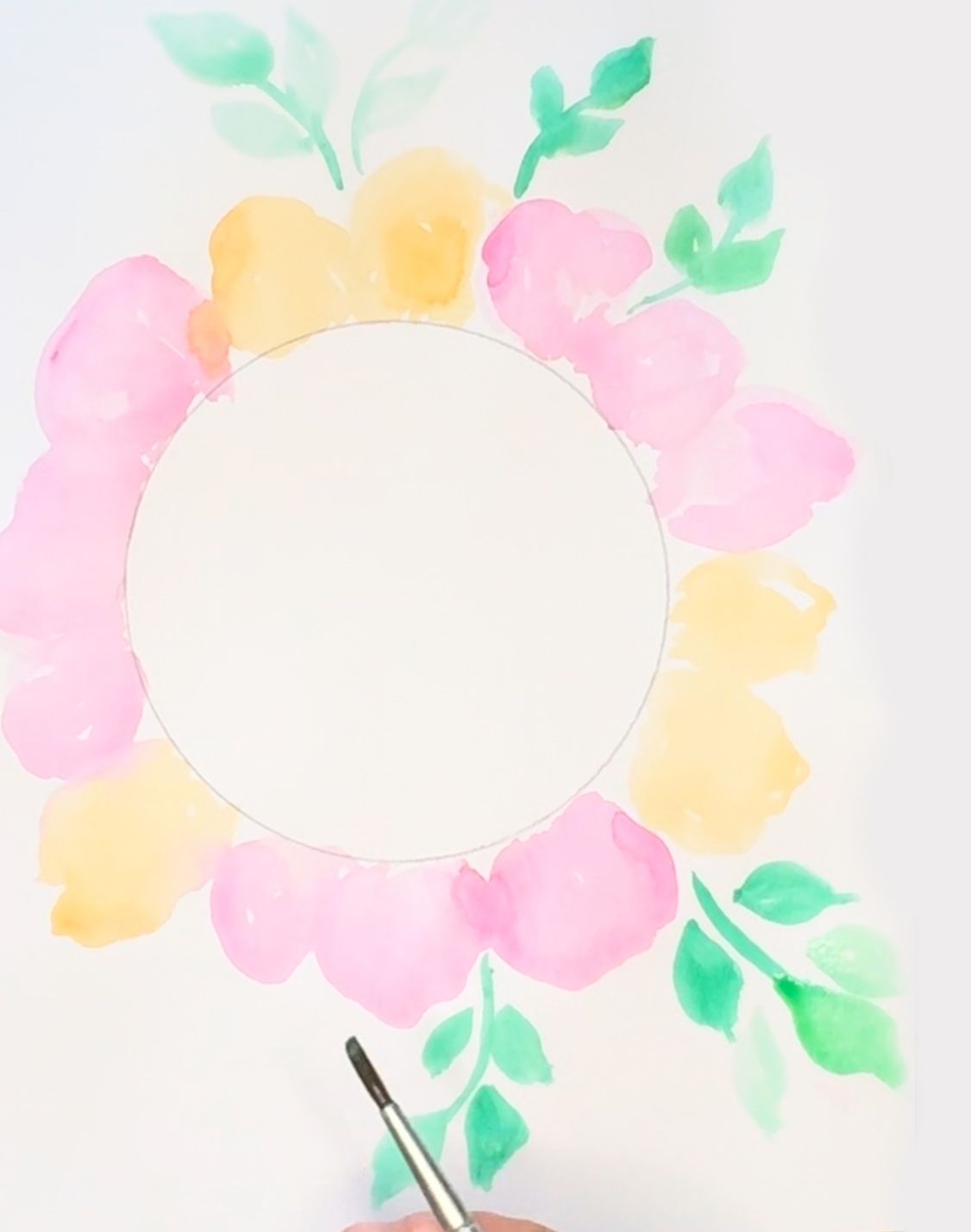 person painting flowers and leaves