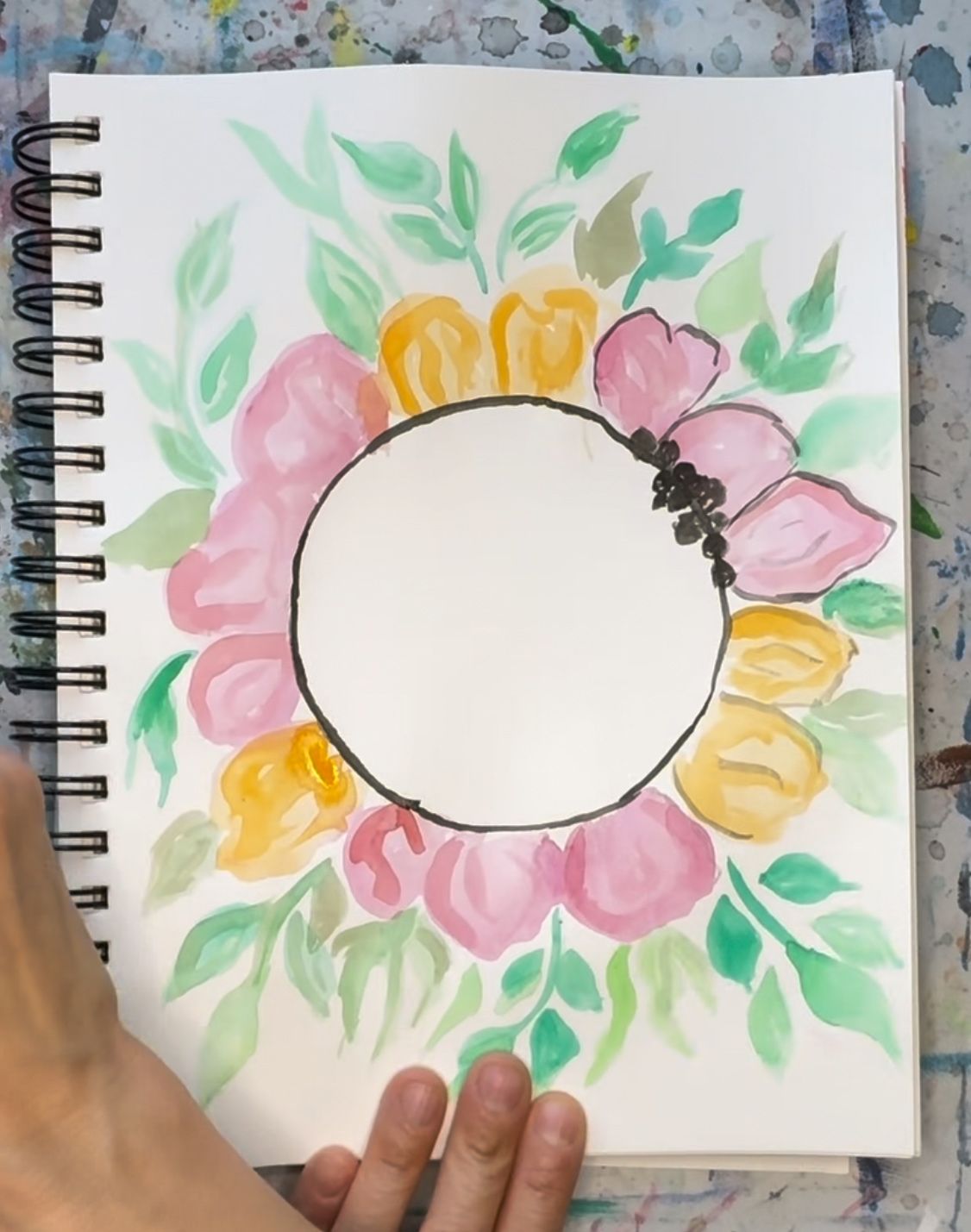 person tracing leaves and petals