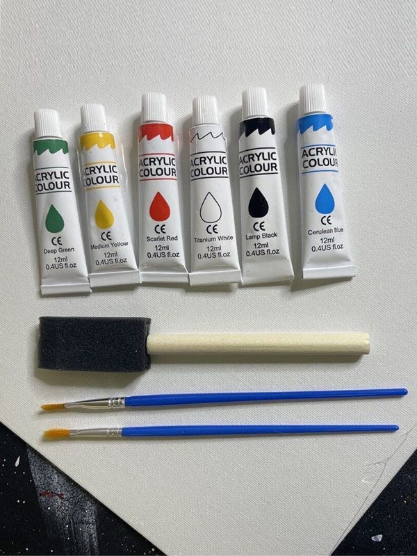A set of acrylic paints with brushes and sponges